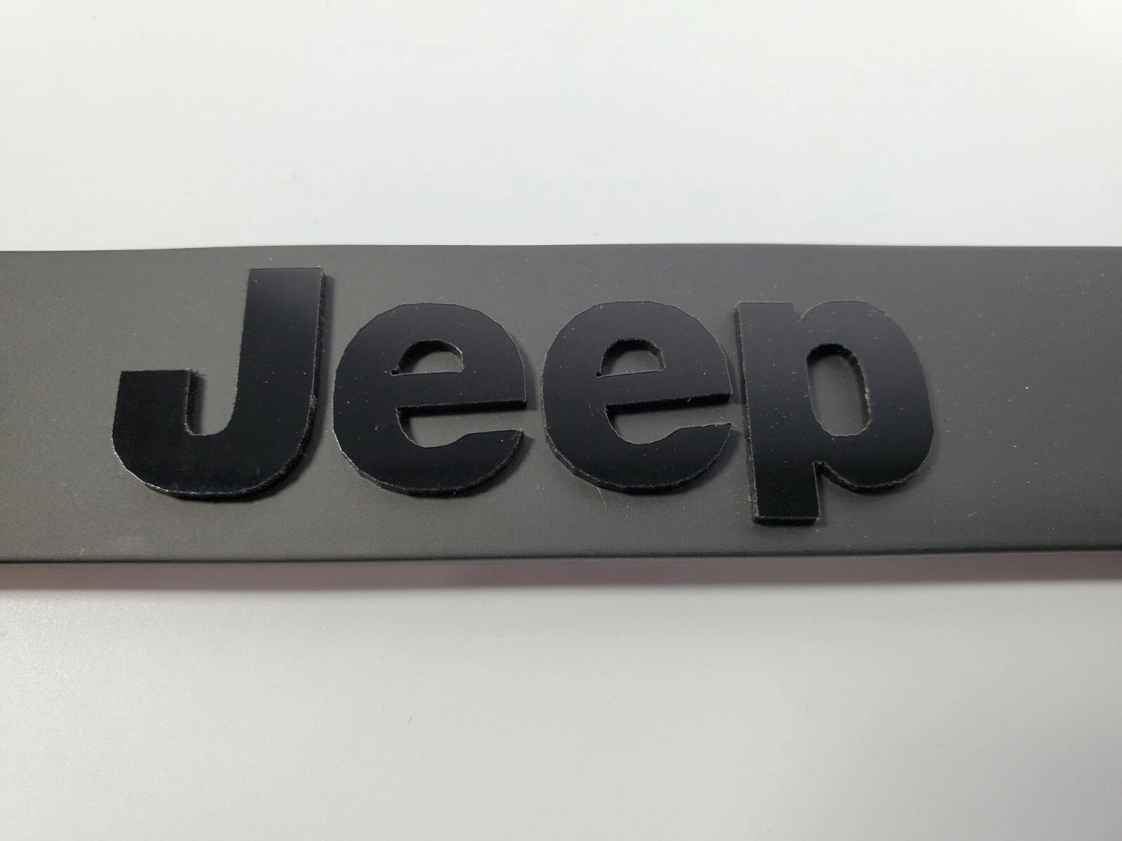 Matte Black Premium License Plate Frame with Script Emblem for Jeep (2007–2025)