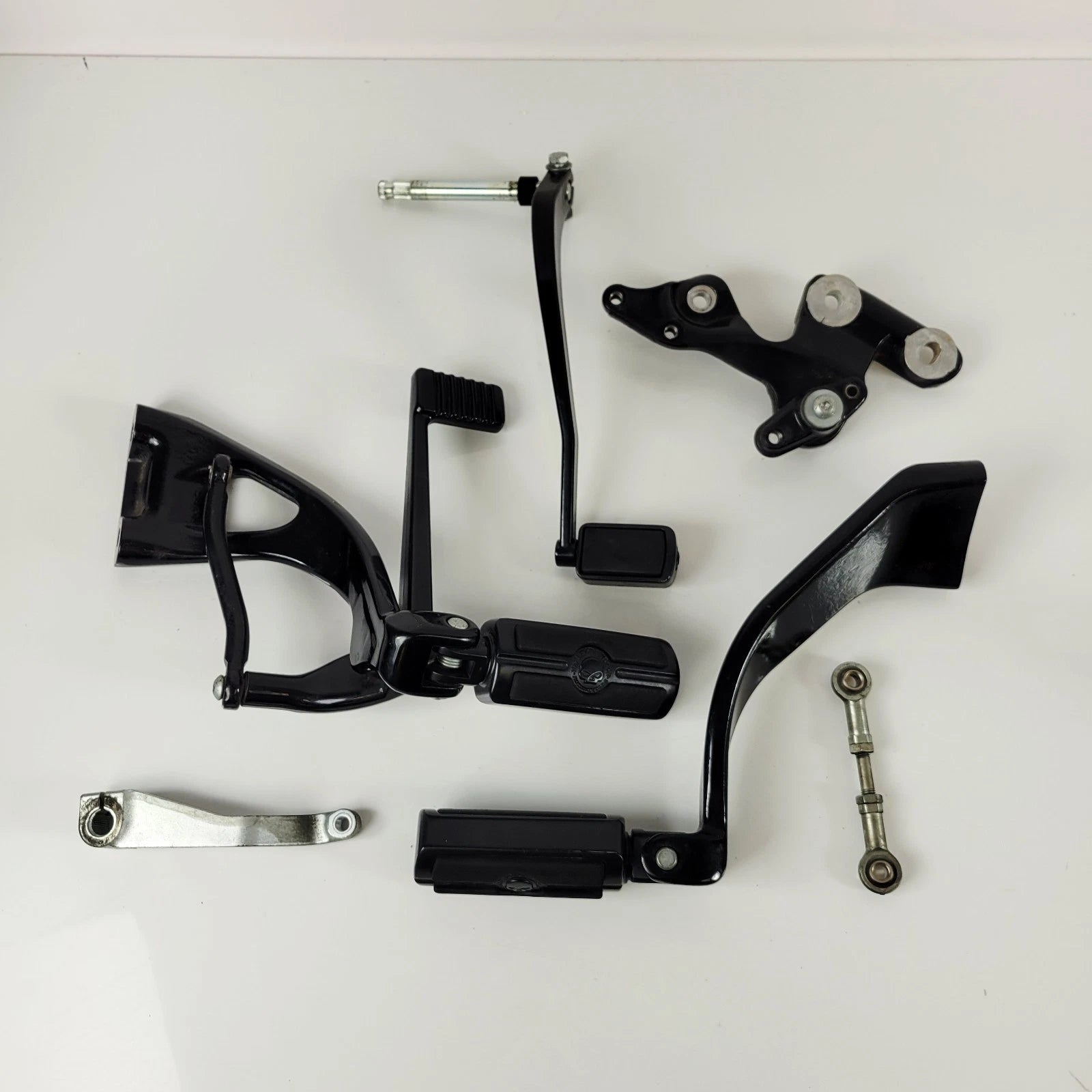 Set of 2 OEM Mid Control Black Willie G Pegs for Harley Softail Street Bob (2018–2023)