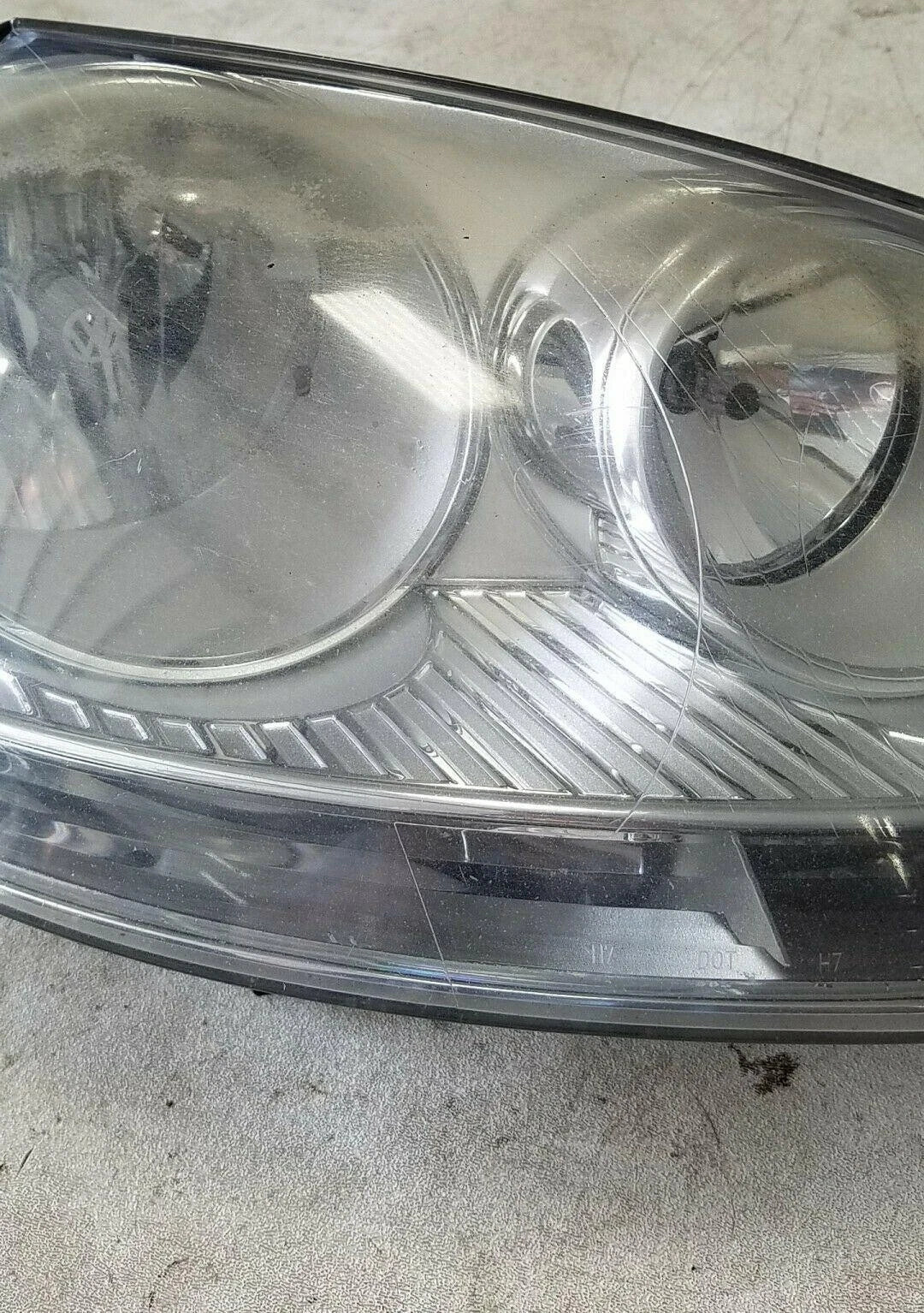 Halogen Headlamp for Volkswagen Jetta Rabbit (2005) OEM Hella 1K6941006S