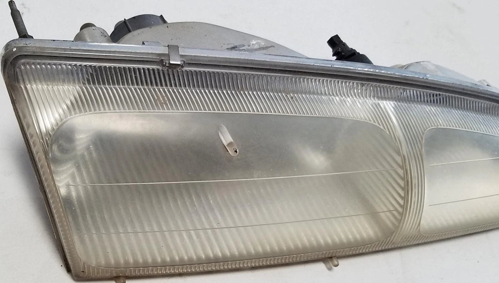 Headlight Passenger Side for Ford Thunderbird Cougar (1996–1997) OEM