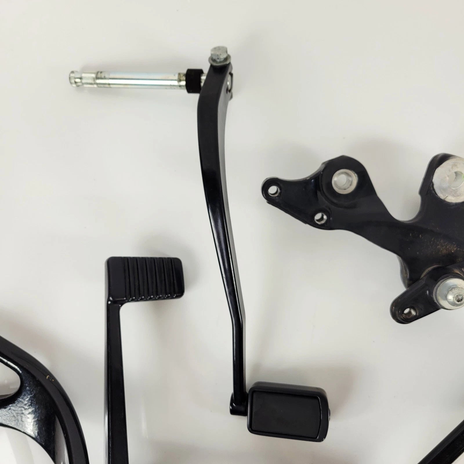 Set of 2 OEM Mid Control Black Willie G Pegs for Harley Softail Street Bob (2018–2023)