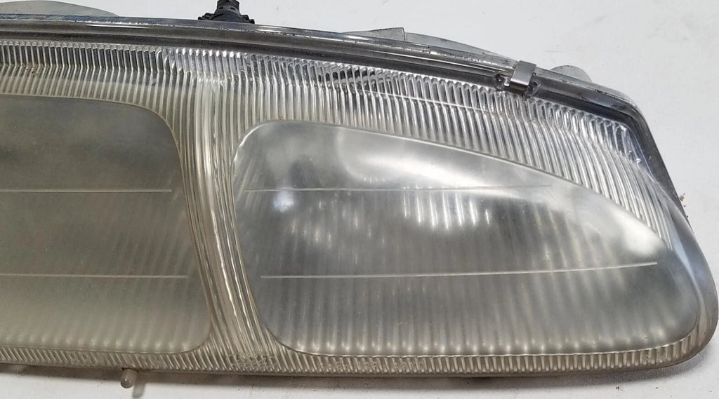 Headlight Passenger Side for Ford Thunderbird Cougar (1996–1997) OEM