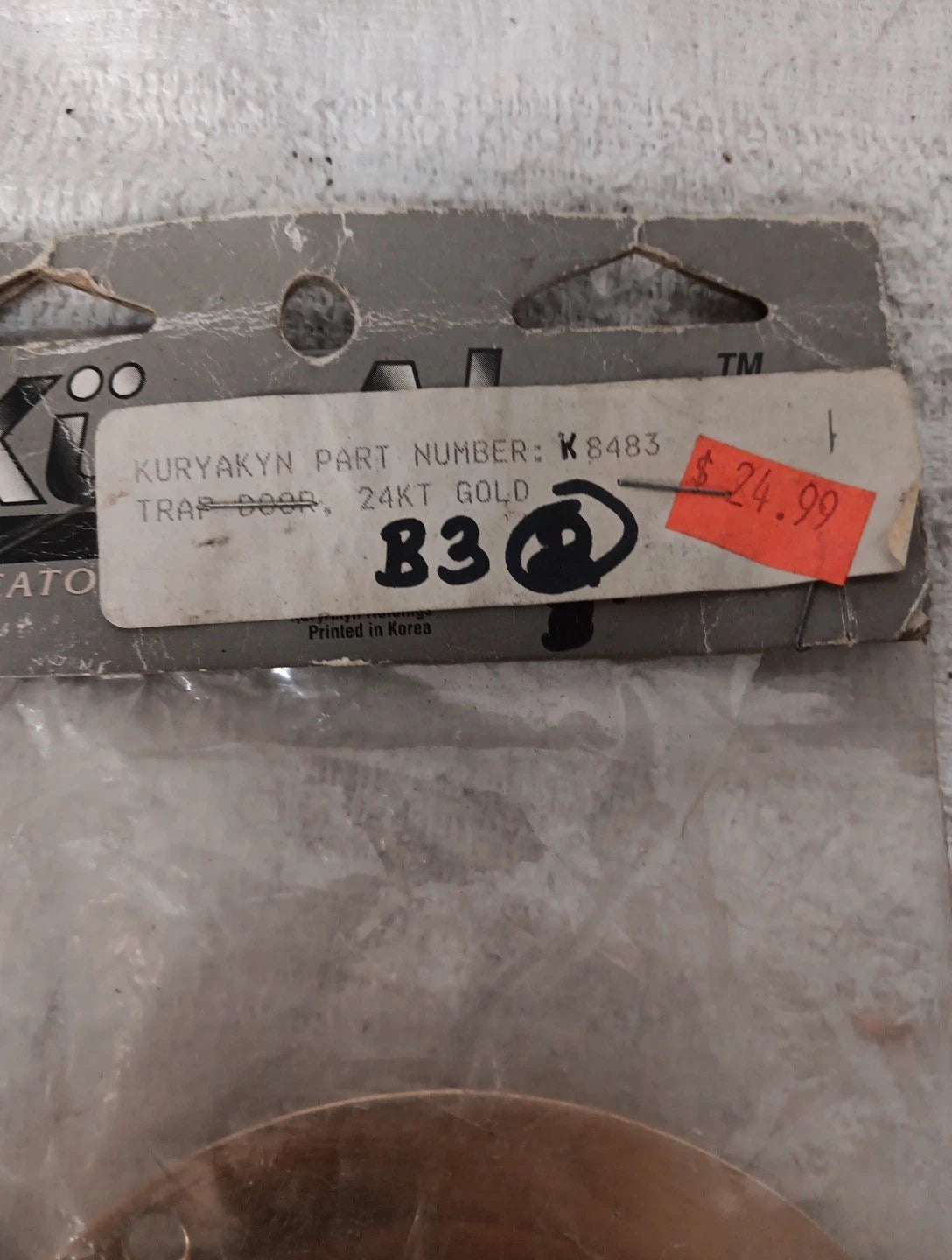 Kuryakyn Gold Trap Door for Harley Davidson (1991–2023) #K8483